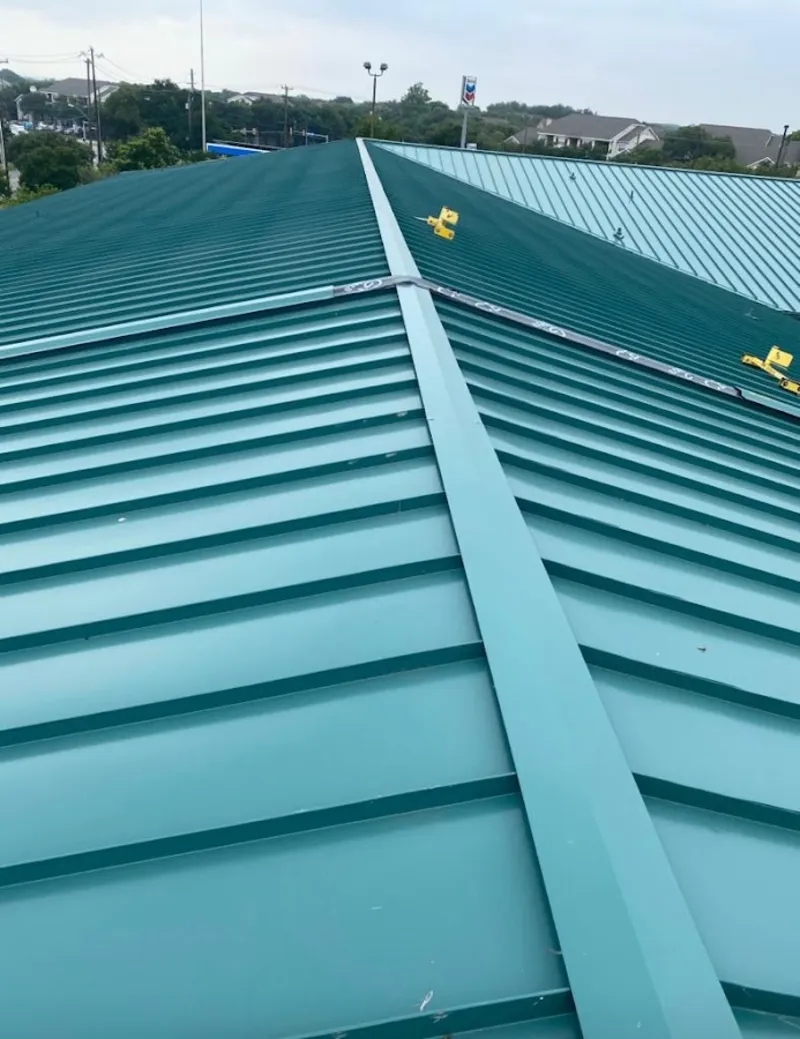 Green commercial metal roof ridge and valley for Metal Roof Repair in Pelham